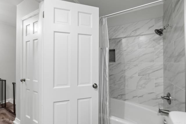 bathroom featuring shower / bath combination with curtain