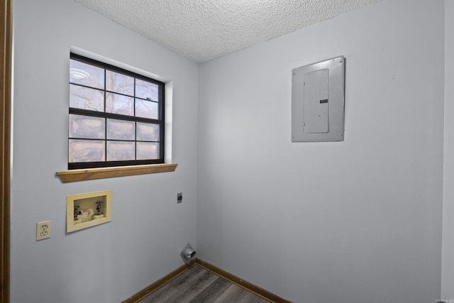 laundry room featuring washer hookup, electric panel, laundry area, electric dryer hookup, and dark wood-style flooring