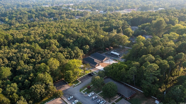 drone / aerial view featuring a forest view