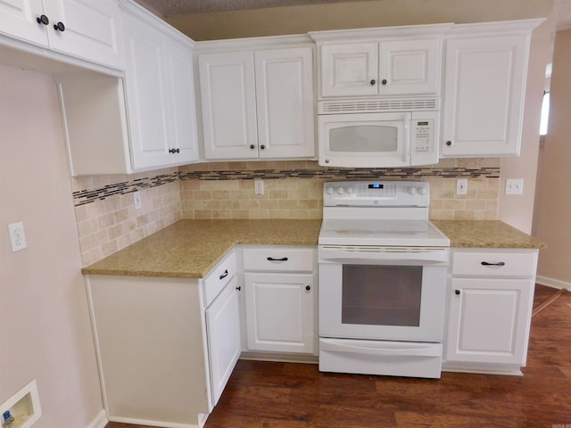 kitchen featuring white appliances, dark wood-type flooring, and white cabinets