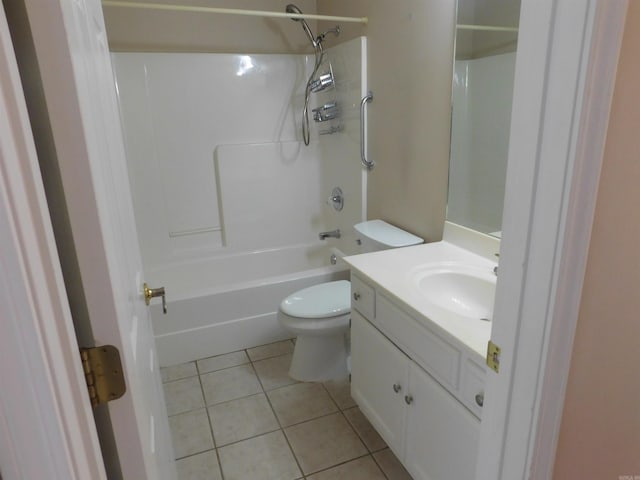 bathroom featuring vanity, tile patterned floors, toilet, and bathing tub / shower combination