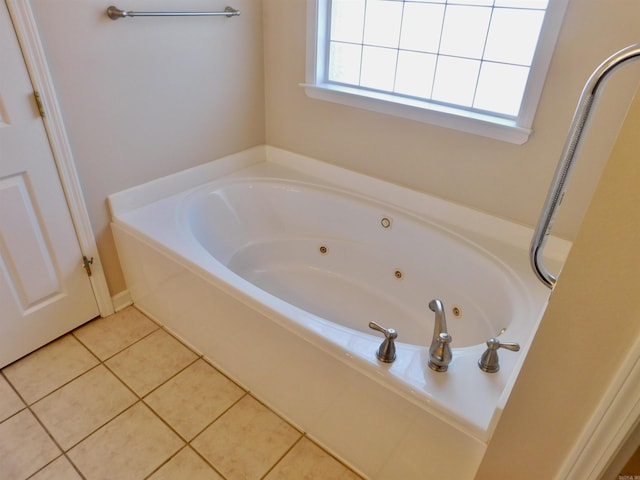 full bathroom with a whirlpool tub and tile patterned flooring