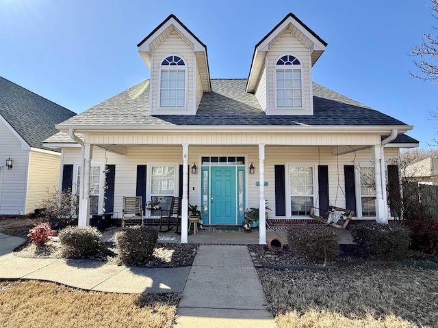 view of front of house featuring a porch and a shingled roof