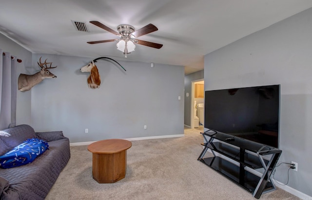 living area featuring visible vents, baseboards, carpet, and a ceiling fan