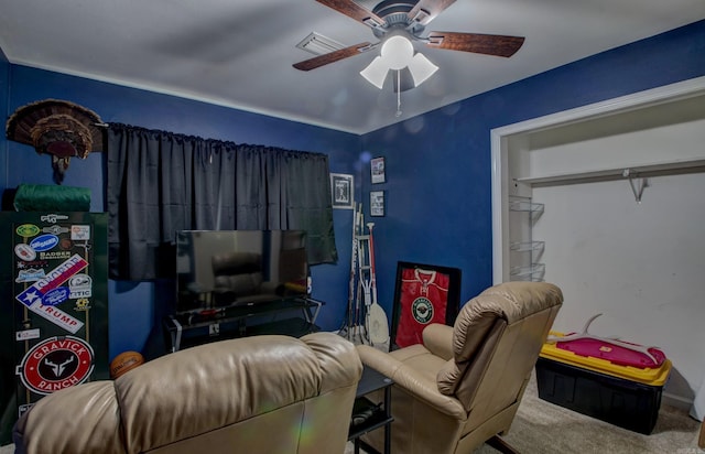 interior space with visible vents, carpet, and ceiling fan