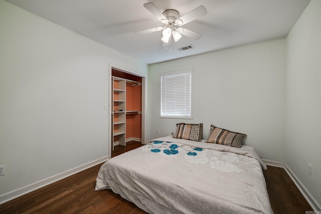 bedroom with visible vents, ceiling fan, baseboards, and wood finished floors