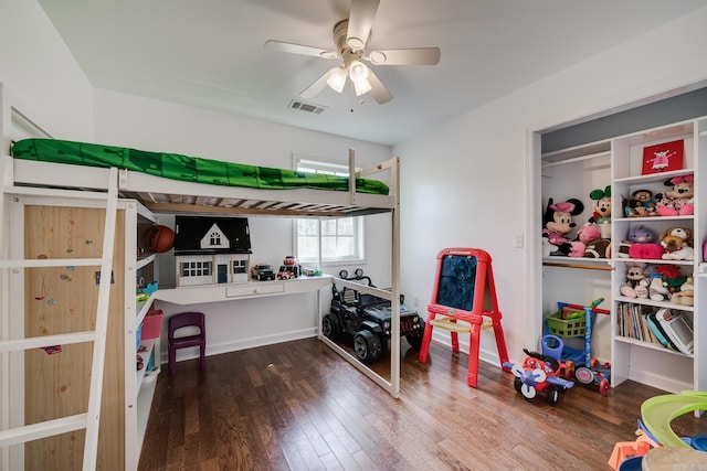 bedroom featuring wood finished floors and visible vents