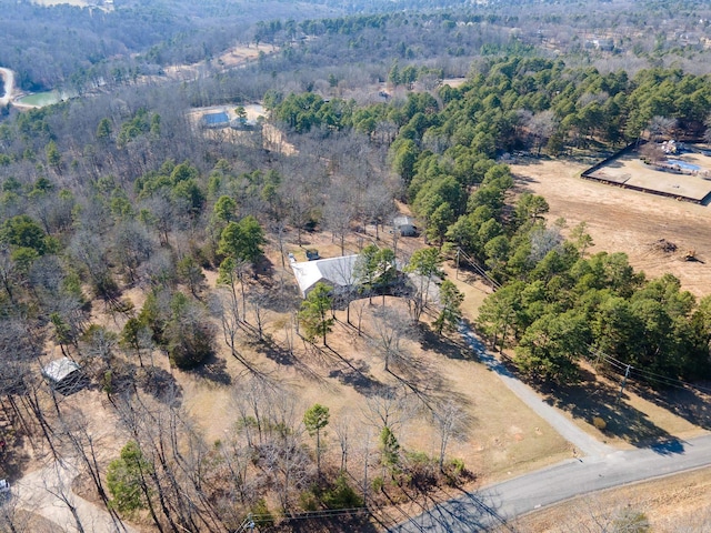 drone / aerial view featuring a forest view