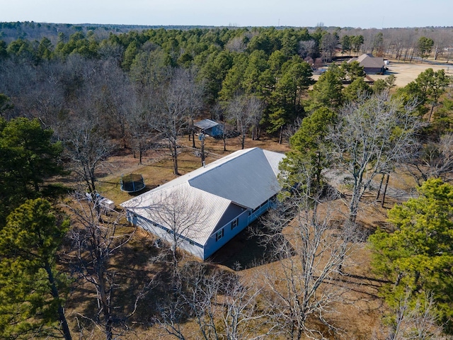 birds eye view of property with a forest view