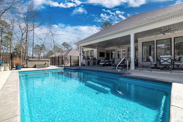 view of swimming pool with a fenced in pool, a hot tub, fence, a patio, and a ceiling fan