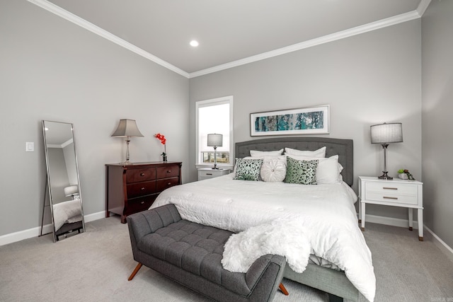 bedroom with crown molding, baseboards, and carpet floors