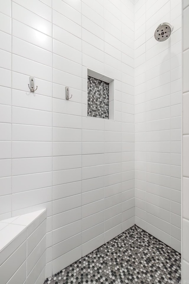 full bathroom with tiled shower