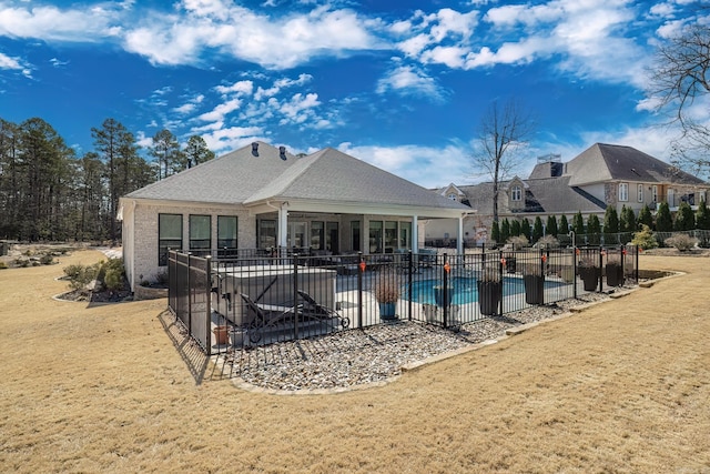 view of swimming pool with a patio, a fenced in pool, fence, and a lawn