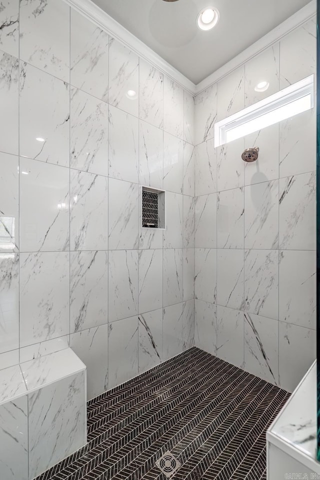 full bathroom with tiled shower