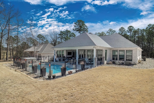 view of pool with a yard, a patio, a fenced in pool, and fence