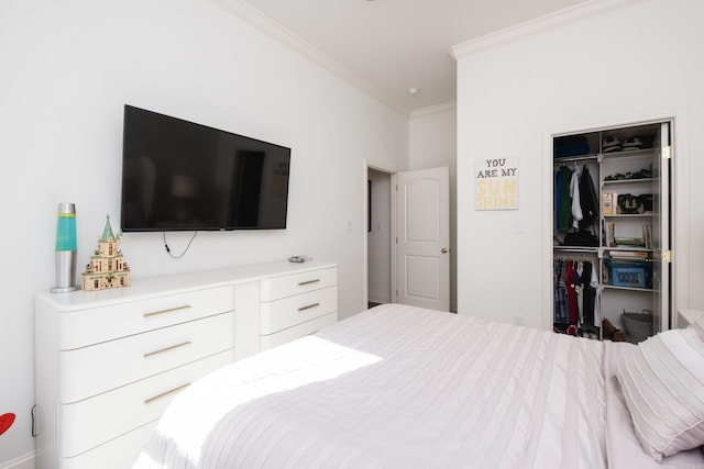 bedroom featuring a closet and crown molding