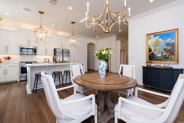 dining area with recessed lighting, arched walkways, crown molding, a chandelier, and dark wood-style flooring