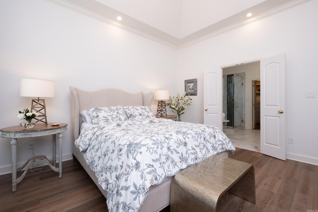 bedroom with crown molding, recessed lighting, wood finished floors, and baseboards