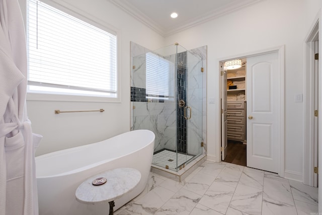 full bath featuring a marble finish shower, a freestanding tub, recessed lighting, crown molding, and marble finish floor