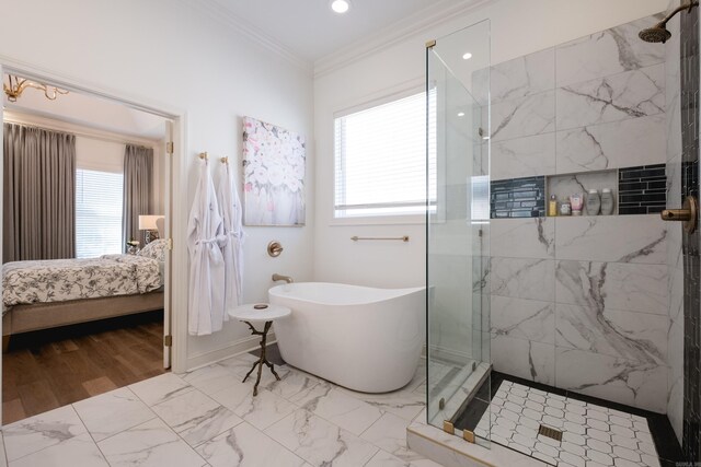 full bathroom with crown molding, a soaking tub, marble finish floor, and a tile shower