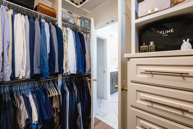 spacious closet with visible vents and marble finish floor