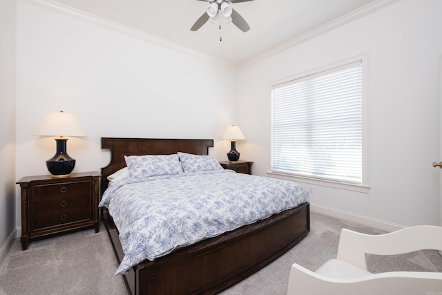 bedroom with light carpet, a ceiling fan, baseboards, and ornamental molding