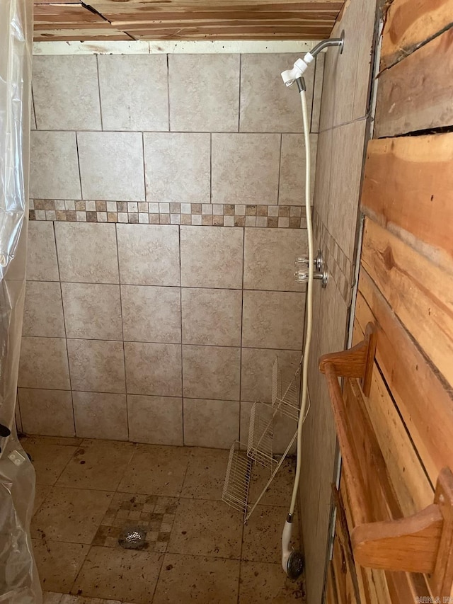 full bathroom with a tile shower