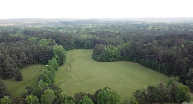 bird's eye view featuring a wooded view