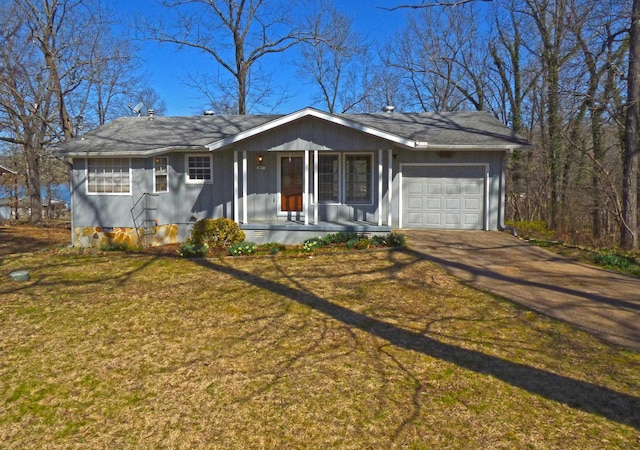 ranch-style house with a front yard, a porch, an attached garage, concrete driveway, and crawl space