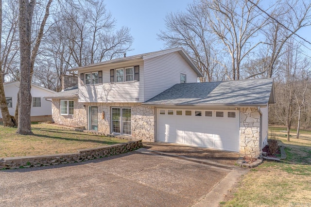 view of front of property featuring a front lawn, stone siding, concrete driveway, a shingled roof, and a garage