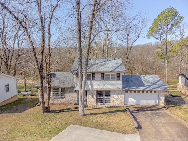78 Altakima Cir, Cherokee Village, AR 72529 - view of front of property featuring stone siding, driveway, a front lawn, and a garage