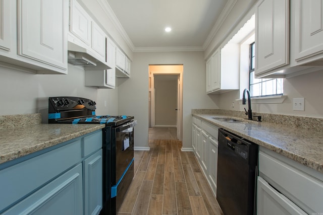 kitchen featuring white cabinetry, black appliances, crown molding, and a sink