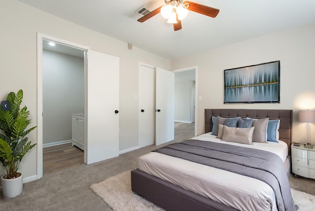 bedroom with visible vents, baseboards, carpet, and ceiling fan