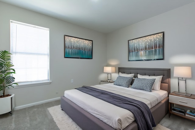 bedroom featuring carpet flooring and baseboards