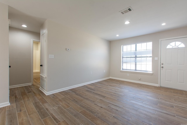 entrance foyer featuring recessed lighting, visible vents, baseboards, and wood finished floors