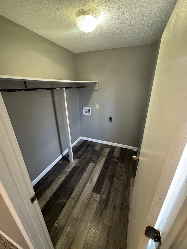 washroom with dark wood-type flooring, baseboards, laundry area, hookup for a washing machine, and hookup for an electric dryer