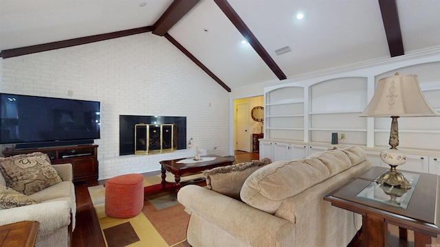 living room featuring visible vents, brick wall, a fireplace, and vaulted ceiling with beams