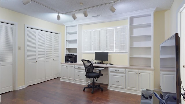 home office with visible vents and dark wood-style floors