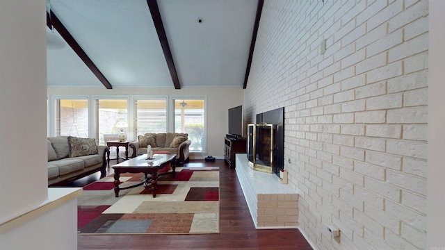 living room featuring lofted ceiling with beams, dark wood finished floors, brick wall, a fireplace, and baseboards