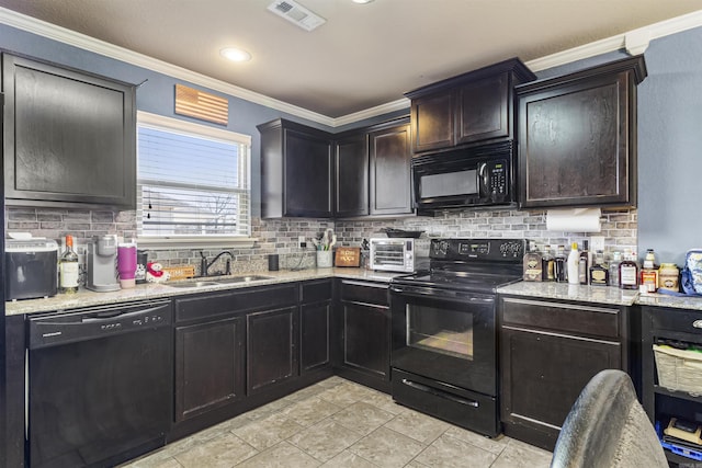 kitchen with visible vents, black appliances, ornamental molding, a sink, and decorative backsplash