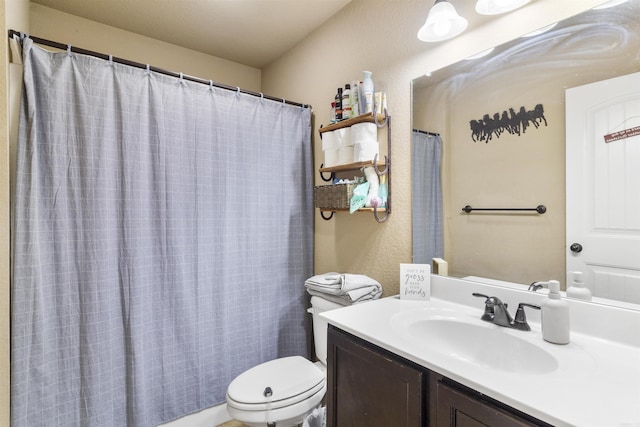 full bathroom featuring toilet and vanity