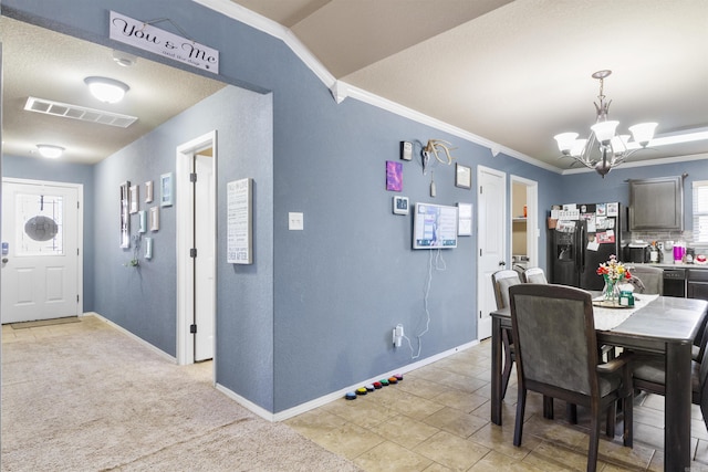 dining space featuring a chandelier, visible vents, crown molding, and baseboards