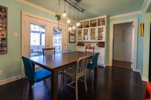 dining room featuring french doors, baseboards, and dark wood-style floors