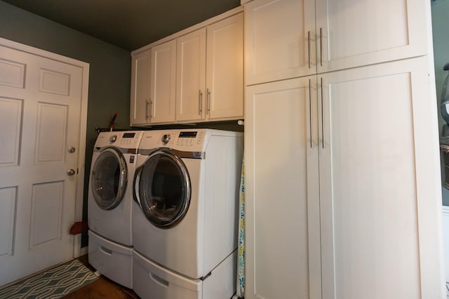 laundry area featuring cabinet space and separate washer and dryer