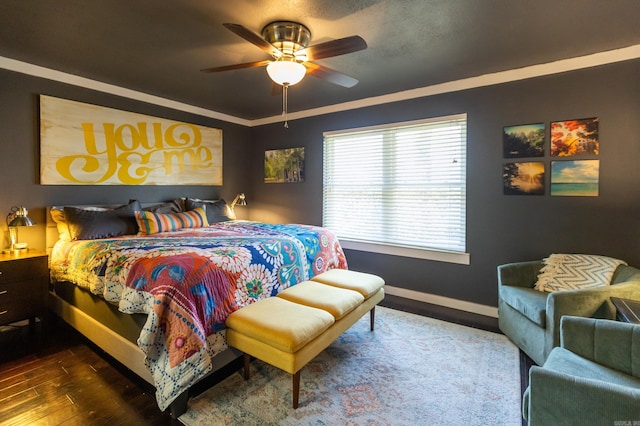 bedroom with a ceiling fan, wood finished floors, and baseboards