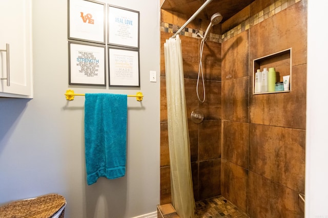 full bath featuring tiled shower