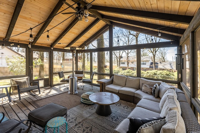 sunroom / solarium with wooden ceiling, vaulted ceiling with beams, and ceiling fan