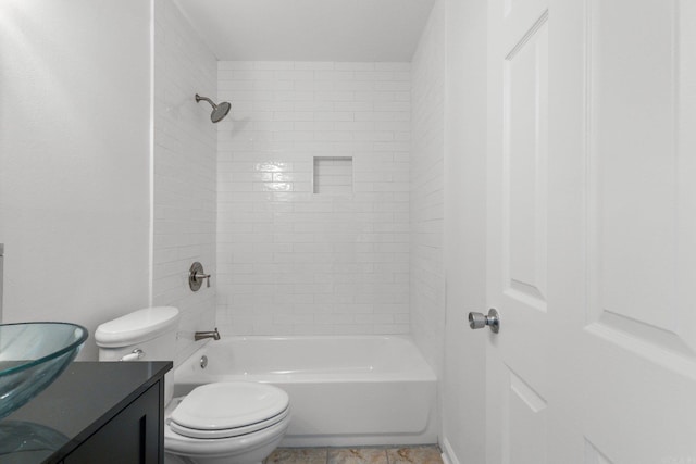 bathroom with toilet,  shower combination, and vanity