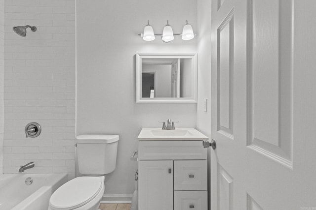 bathroom with baseboards, washtub / shower combination, toilet, tile patterned floors, and vanity