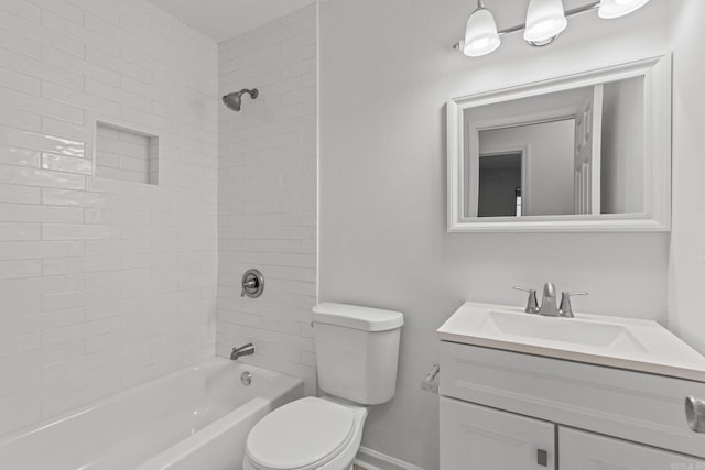 full bath featuring vanity, toilet, baseboards, and shower / bathtub combination